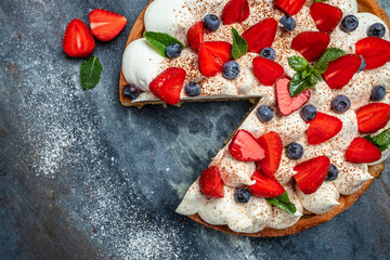 Homemade tart pie or cake with whipped cream and fresh raspberry. Food recipe background. Close up