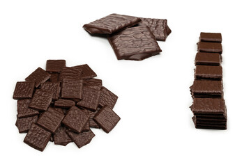 Dark chocolate candies isolated on white background.
