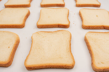Delicious bread slices isolated on a white background, top view.