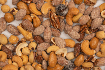A group of almonds, pistachios, walnuts, macadamia, cashews.