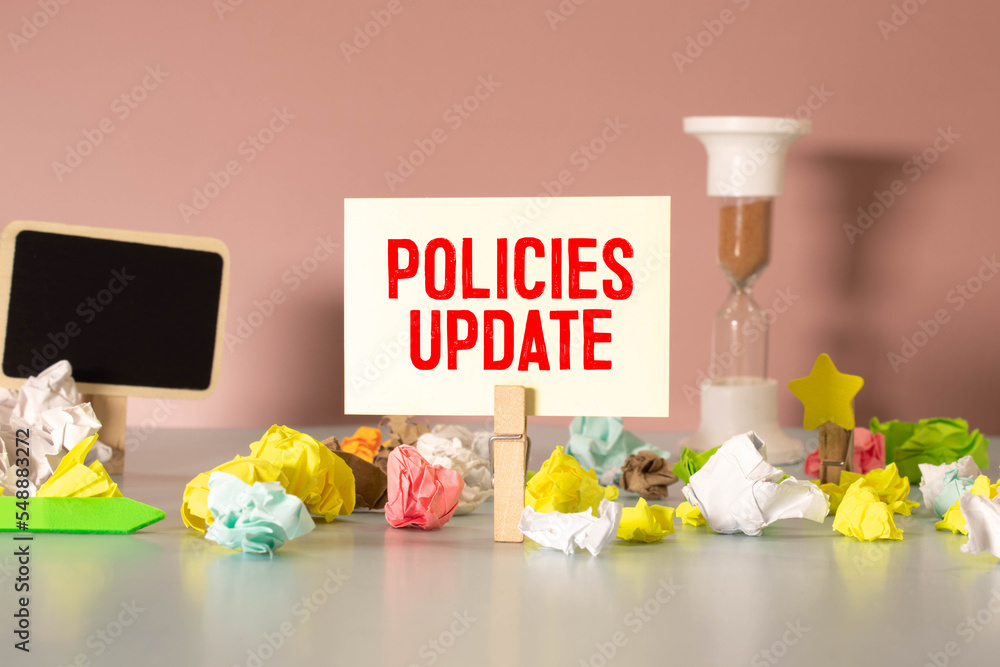 Poster policies update memo written on a notebook with pen