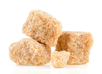 Brown cane sugar cubes isolated on a white background. Unrefined demerara sugar pieces.