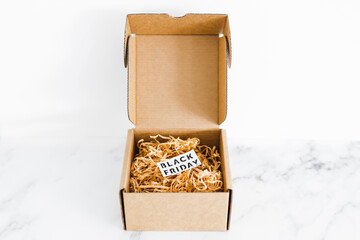 promotions and shopping deals over the festive season, parcel or gift box with Black friday label inside of it