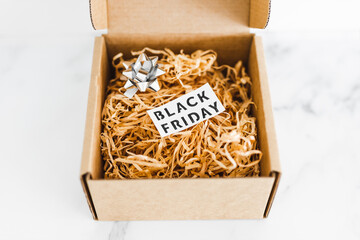 promotions and shopping deals over the festive season, parcel or gift box with Black friday label inside of it