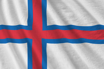 Faroe islands flag with big folds waving close up under the studio light indoors. The official symbols and colors in banner