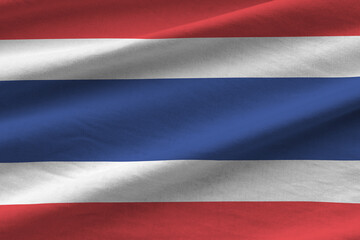 Thailand flag with big folds waving close up under the studio light indoors. The official symbols...