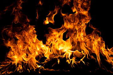 Flame fires. Burn lights on a black background. Fire flames on black background. Abstract fire...