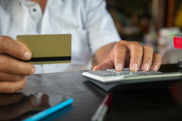 businessman using calculator tax in office.