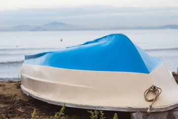 upside down boat across the sea