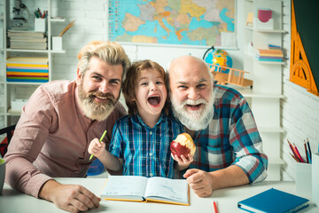 Grandfather father and son, men in different ages ready to study. Happy family at school. Three men generation. Knowledge and education concept.