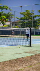 playing indoor tennis at a sports club during the summer professionally in a championship