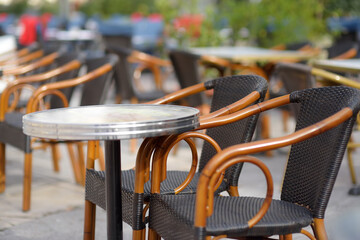 An empty stylish street cafe in a European city. Cozy outdoor restaurant.