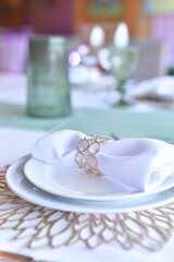 
Serving and decoration of the wedding table. Glasses, spoons, forks and white napkins
