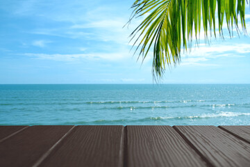 Beautiful foreground wooden floor and blue sea and sky background.