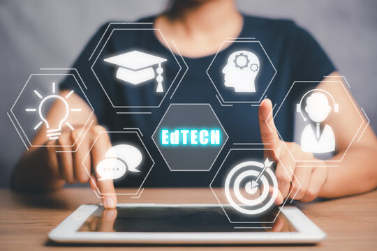 EdTech Education technology distance learning online concept, Person using digital tablet with Edtech icon on VR screen.