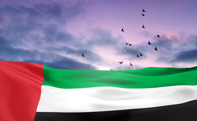 UAE flag on background of cloudy sunset or sunrise. Background for National Day