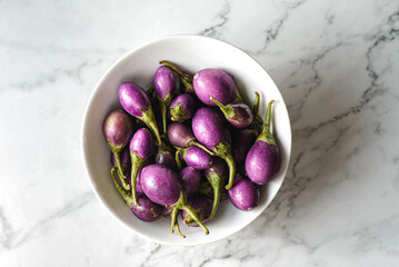 mini eggplant on a light background