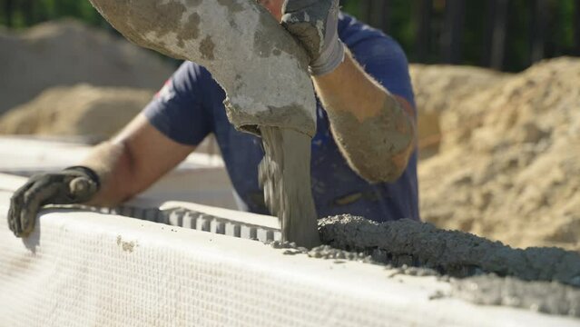 Pouring cement in ICF block