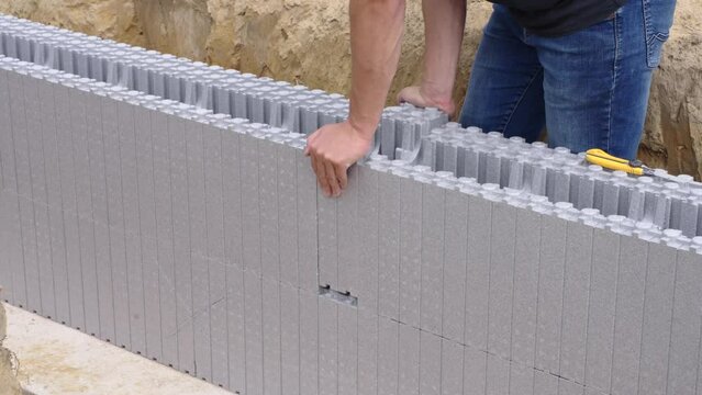 Placing piece of ICF block in joint