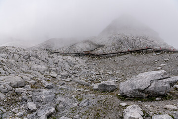 Unidentified Peoples hiking on Jade Dragon Snow Mountain, It's highest peak is named Shanzidou (5,596 m or 18,360 ft)