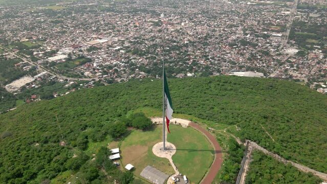 Mexican flag over the city of Iguala in the state of Guerrero