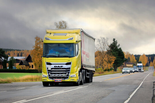 New Yellow DAF XG 530 Truck Semi Trailer on Road in Autumn.