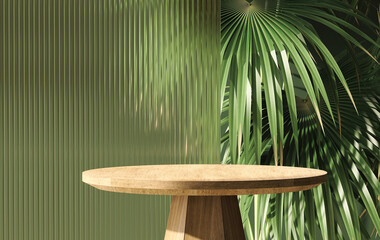 Modern, minimal round wooden table podium with tropical palm tree and reeded glass partition in dappled sunlight on green wall for luxury, organic, beauty, cosmetic product display