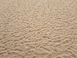 closeup of sand pattern of a beach in the summer