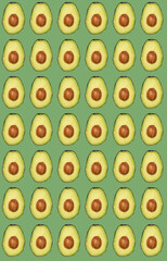 seamless pattern of half fresh avocado on green background