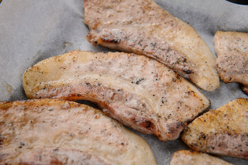 The pork belly is being grilled