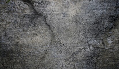 A weathered concrete wall with cracks and peeling paint, showing signs of age and decay.