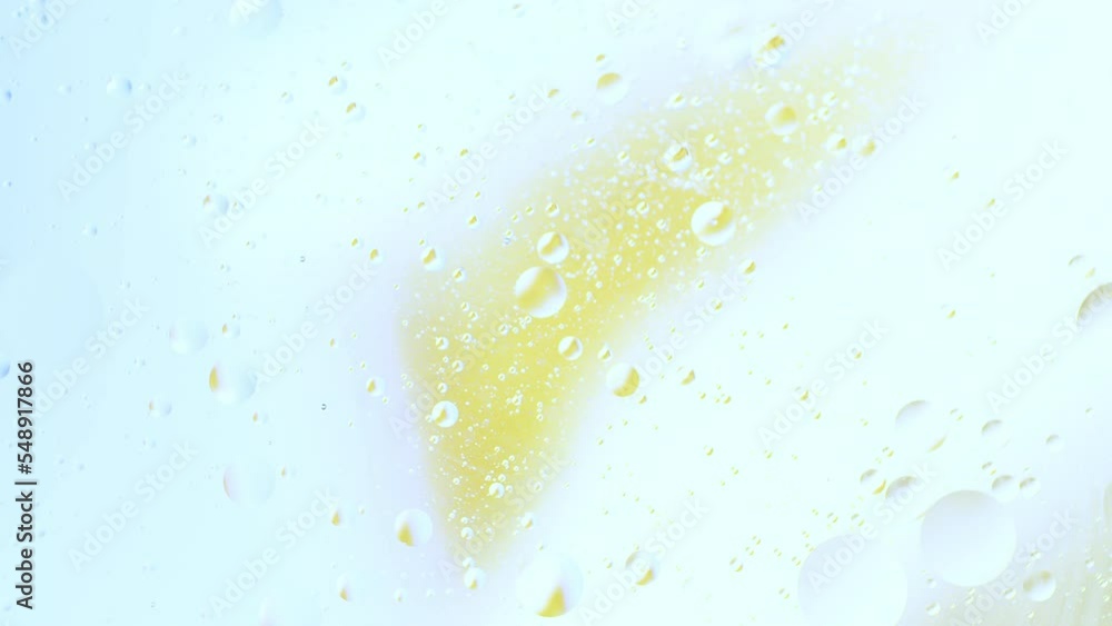 Poster real close up oil bubbles in water rotation with color gradient abstract mixing background.