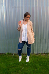 young beautiful woman in a jacket and jeans