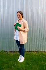 young beautiful woman in a jacket and jeans