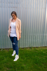 young beautiful woman in a jacket and jeans