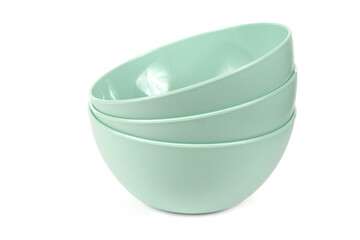 Plastic plates on a white background. Three modern plastic plates. Dishes close-up.