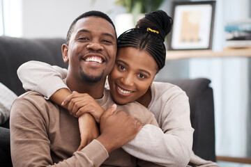 Love, hug and portrait of a happy couple on sofa in the living room of their modern home....