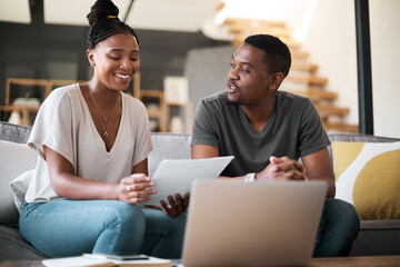 Laptop, finance and budget with a black couple working on debt or accounting or banking in their home living room. Computer, documents and investment with a man and woman financial planning online