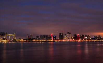 city skyline at night with river