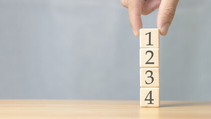 management concept Priority of any activity Set the priority of tasks Organize your to-dos. wooden cubes with numbers 1, 2, 3 and 4