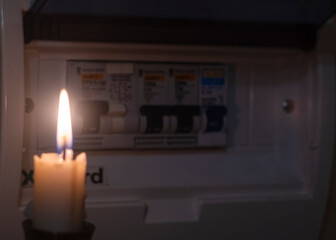 candle and electrical switches, electricity cut-off, blackout	