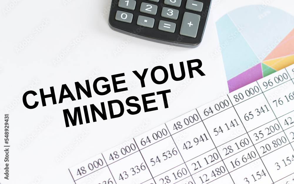 Poster change your mindset text notepad and on office white table