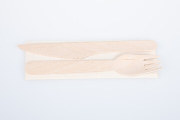 recyclable wooden fork and knife made from recycled paper and wood on white Background