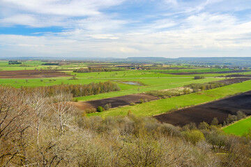Scenic view over a agricultural landscape at spring