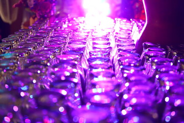 Defocused blurred abstract background, The glasses are neatly arranged against a very bright light background