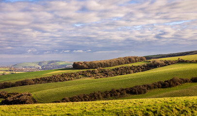 Clouds breaking over autumn landscape of the south downs along Falmer road Brighton East Sussex south east England.