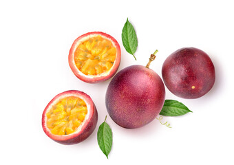 Flat lay of purple passion fruit with cut in half and green leaf isolated on white background..