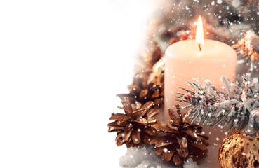 Beige snow Christmas composition. Burning candle and fir cones Cutout, snowfall