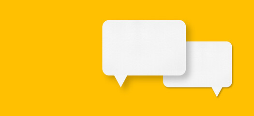 speech balloon shape white paper isolated on yellow background