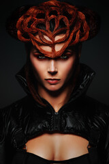 Portrait of a pretty young woman, wearing an avant-garde hairstyle